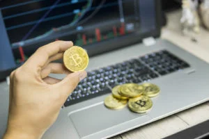 How to Learn Forex Trading 2 Businessman holding bitcoin