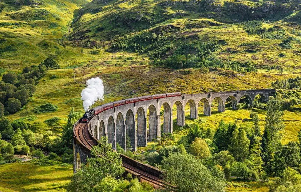 Glenfinnan railway viaduct in Scotland With Train