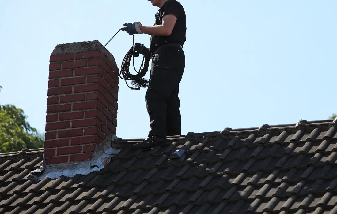 Chimney-sweep-cleaning-a-chimney