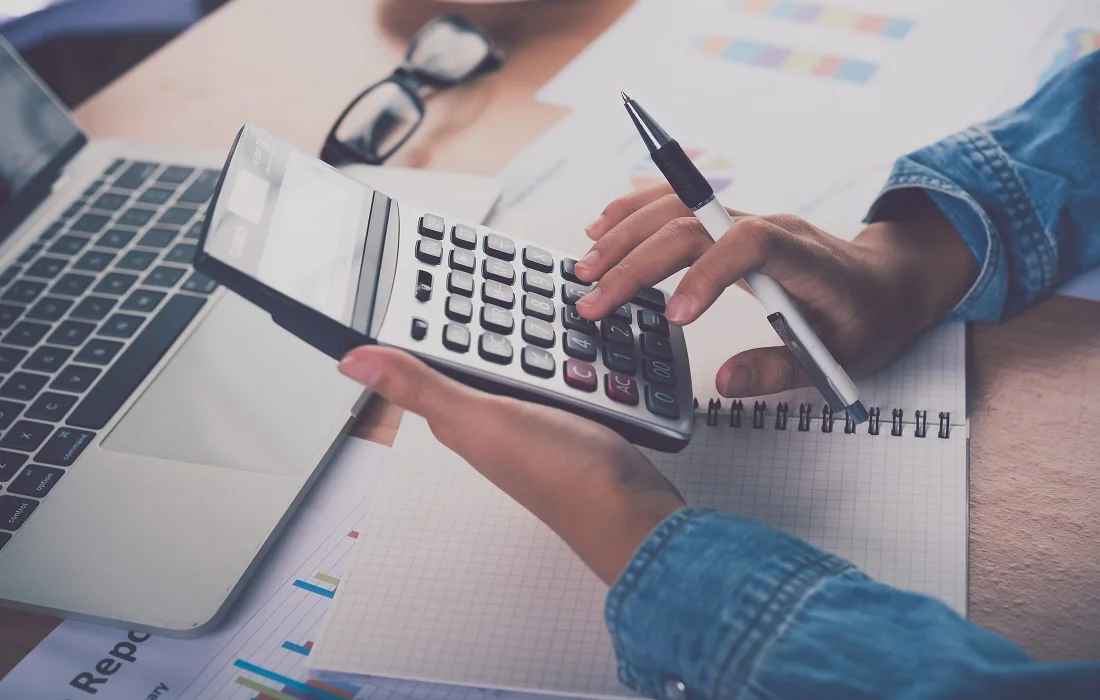 How to Explore the Benefits of Professional Tax Preparation 4 The-accountants-hand-is-using-the-calculator-for-cost-analysis