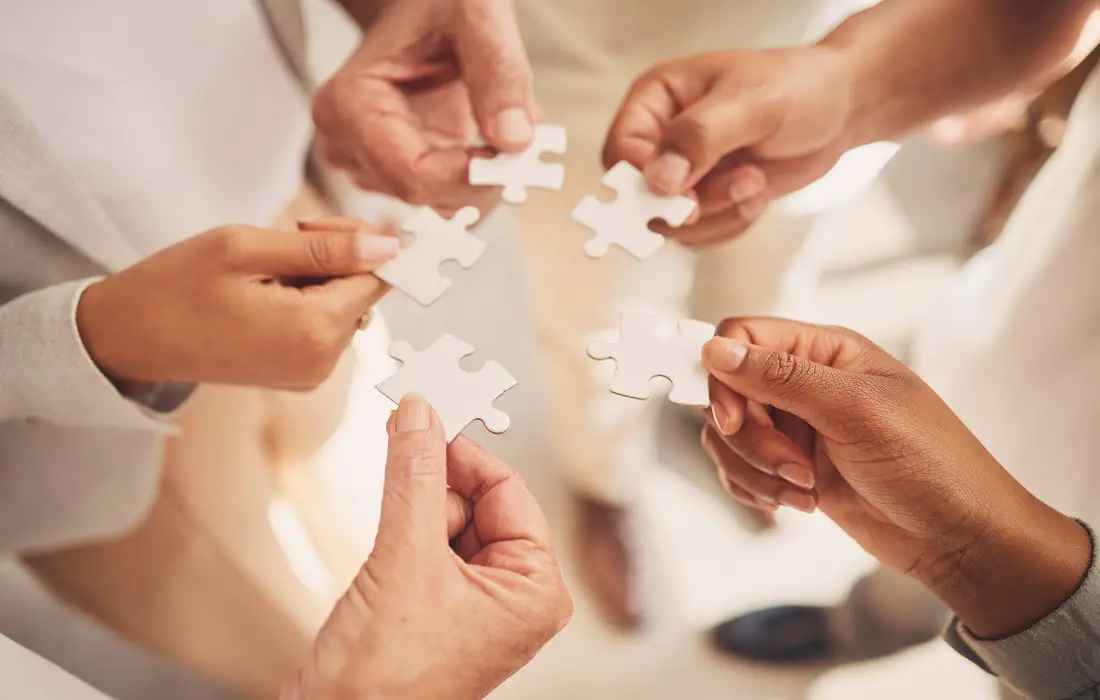 team-collaboration-hands-teamwork-and-puzzle-piece